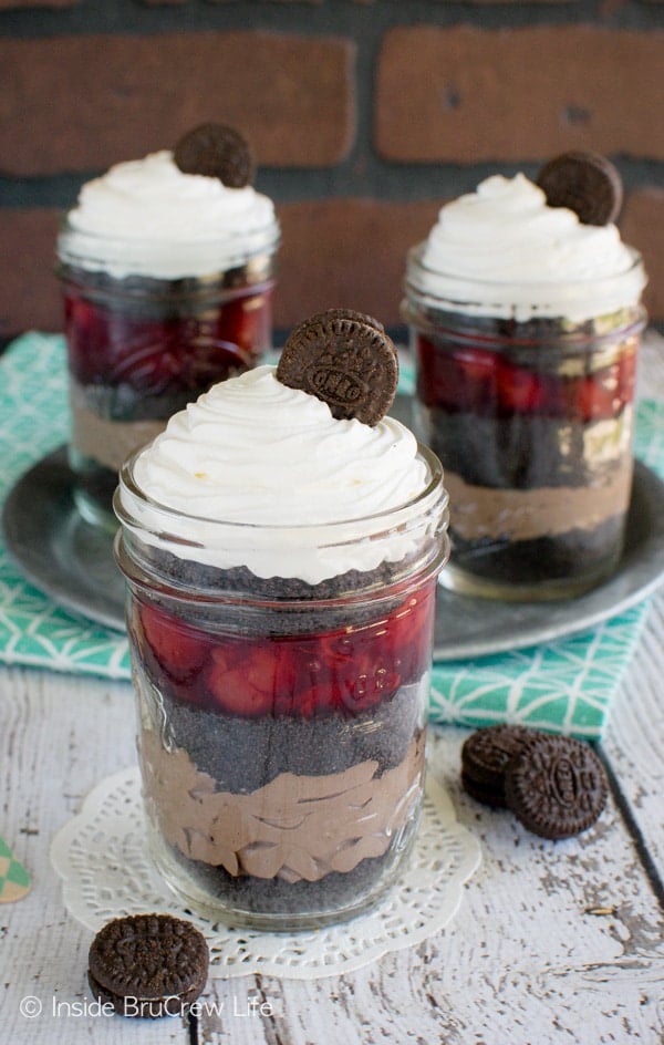 Cookies, cherry pie filling, and chocolate cheesecake make these Cherry Chocolate Mousse Parfaits great for summer picnics. Awesome no bake recipe!
