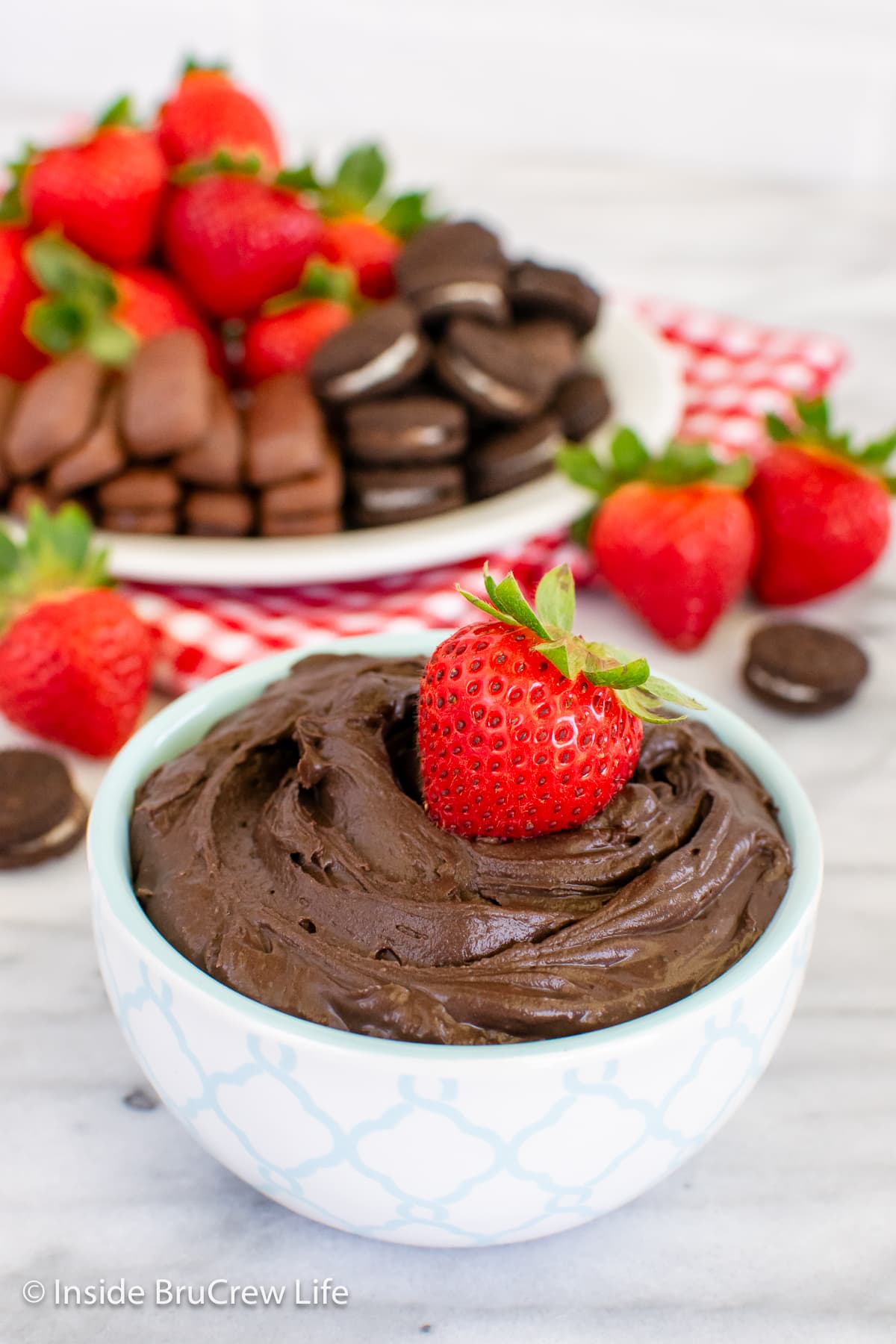 A white bowl filled with creamy cocoa dip.