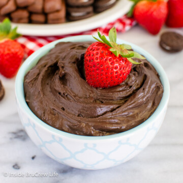 A white bowl filled with creamy chocolate dip.