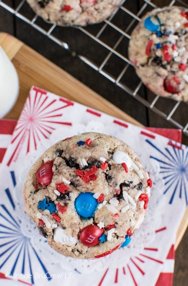 An overhead picture of a Fireworks Cookies and Cream Cookie with lots of red white and blue sprinkles and M&M candies in it