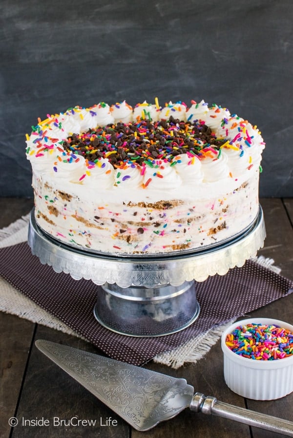 A full sized cookie ice box cake on a cake stand.