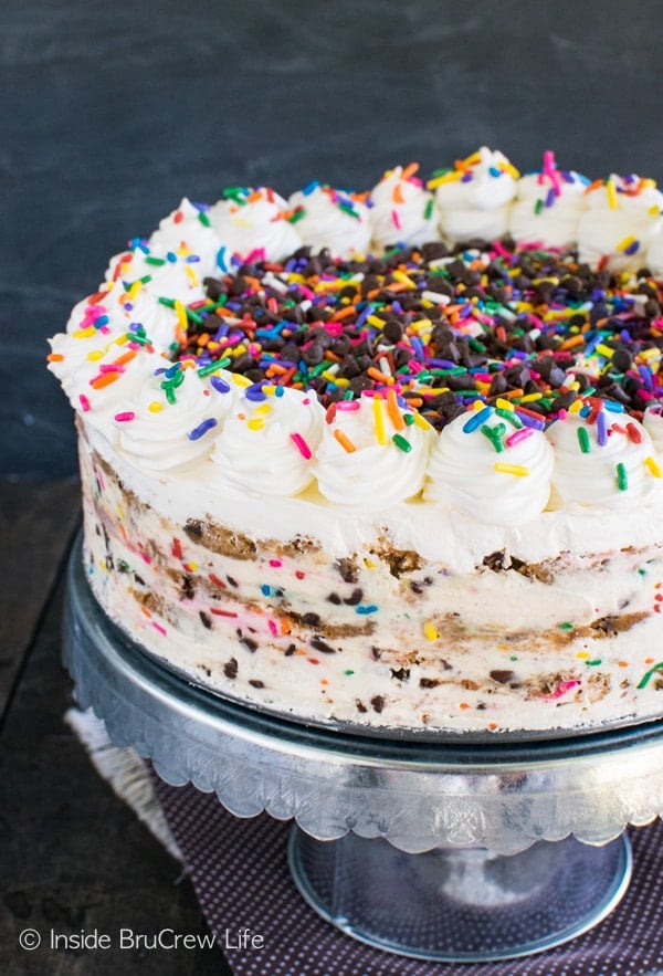 A large no bake cookie cake on a cake plate.