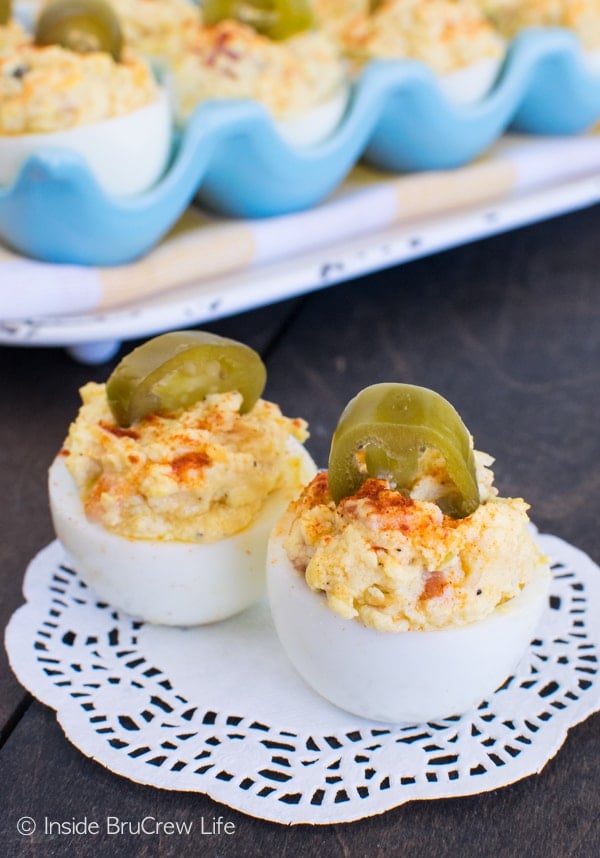 2 halves of a deviled egg on a white doily.