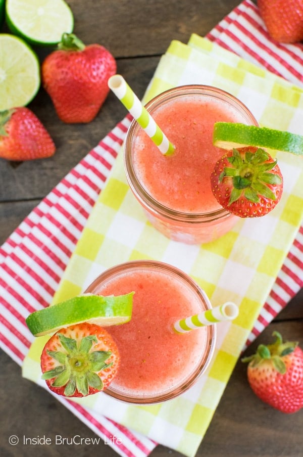 Strawberry Limeade Slushies - these easy chilly drinks are a great way to use up the berries in the fridge! Great drink recipe for hot days!