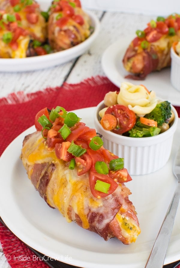 Broccoli Cheese Stuffed Pork Tenderloins - gooey cheese, broccoli, and tomatoes make these tenderloins an amazing dinner recipe for the grill.