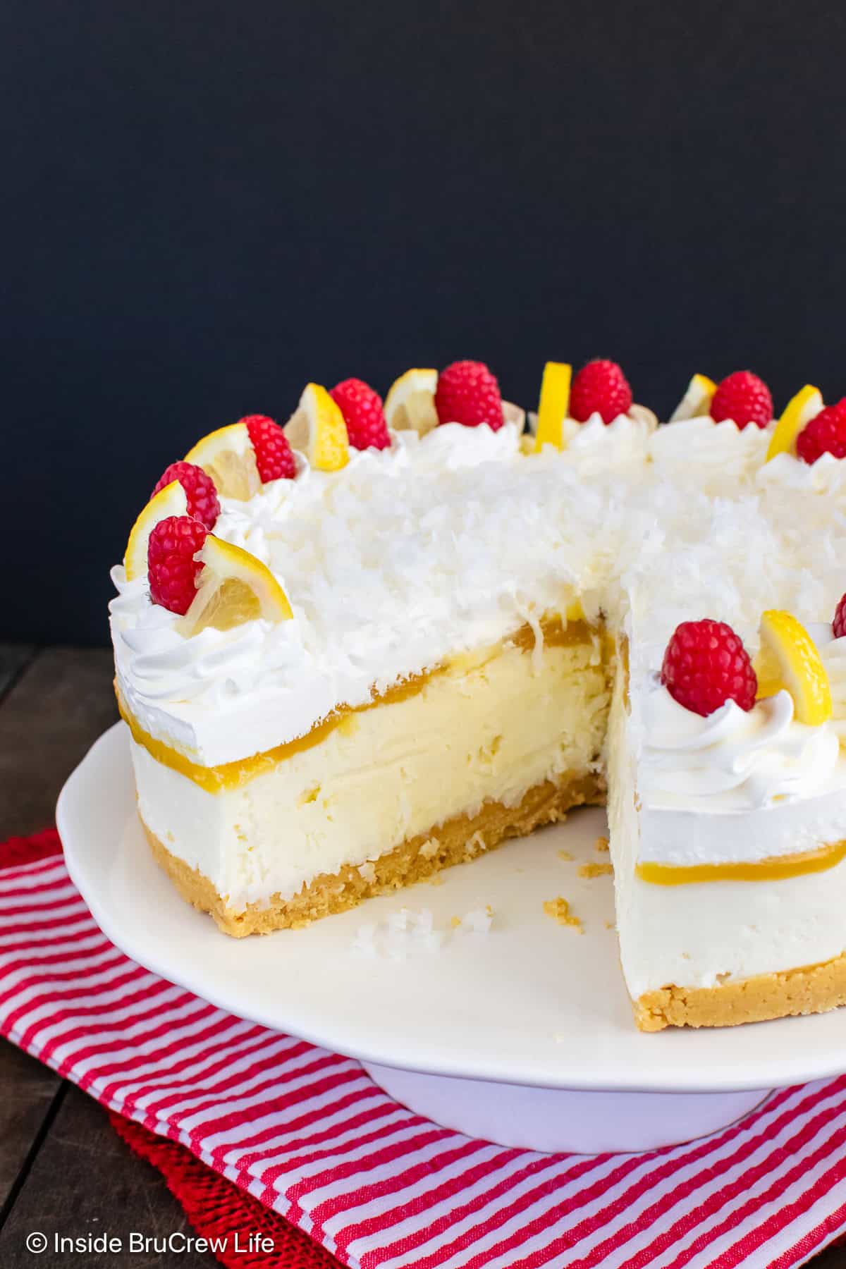 An inside look at the layers inside a no bake lemon coconut cheesecake.