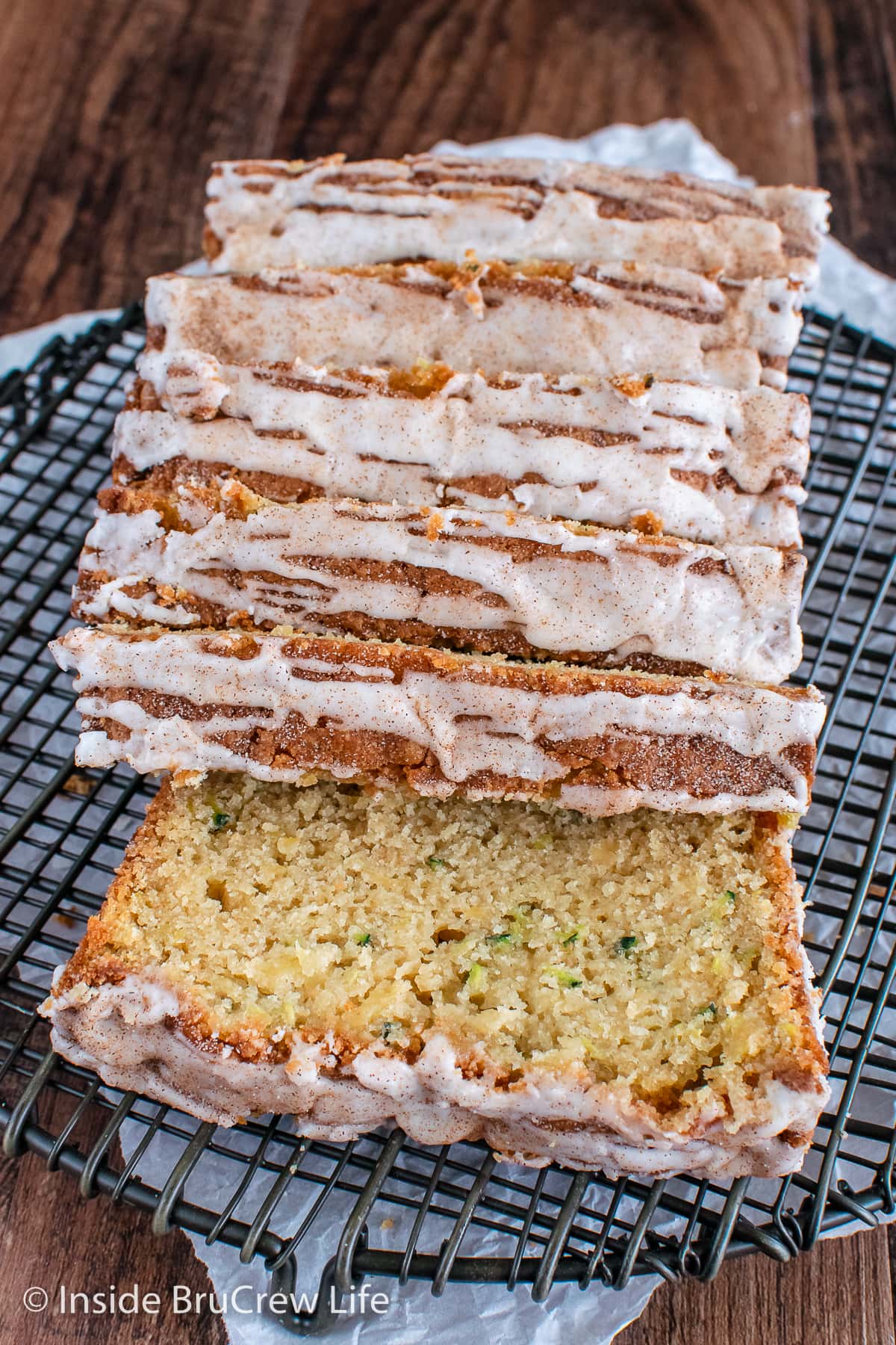 Slices of zucchini bread on a wire rack.