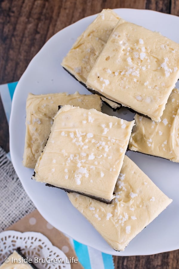 An overhead picture of salted caramel chocolate sugar cookie bars on a white plate