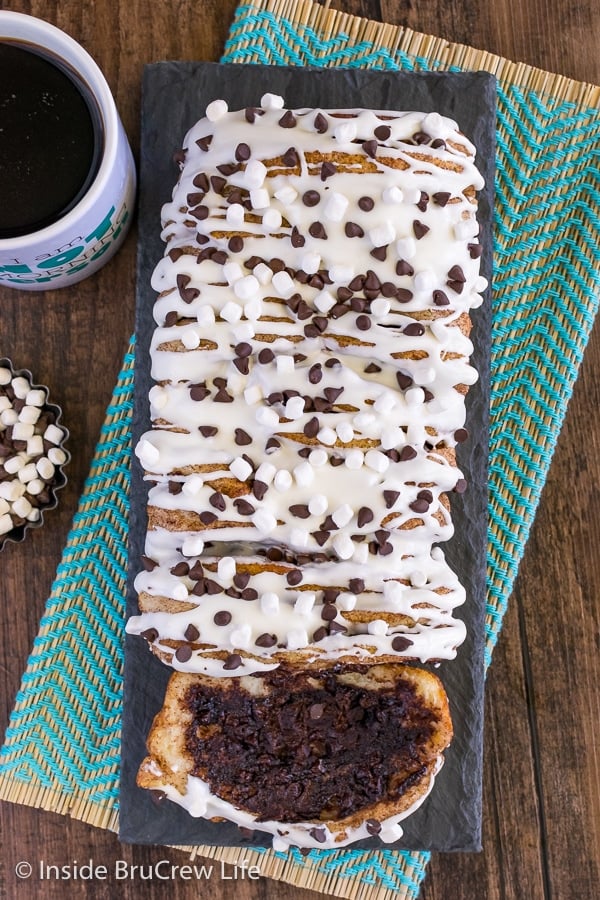 An overhead picture of gooey s'mores pull apart bread drizzled with marshmallow glaze