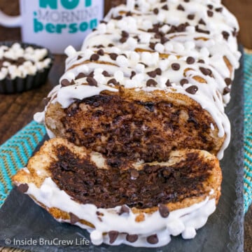 A loaf of gooey s'mores pull apart bread with a slice lying down in front of it.