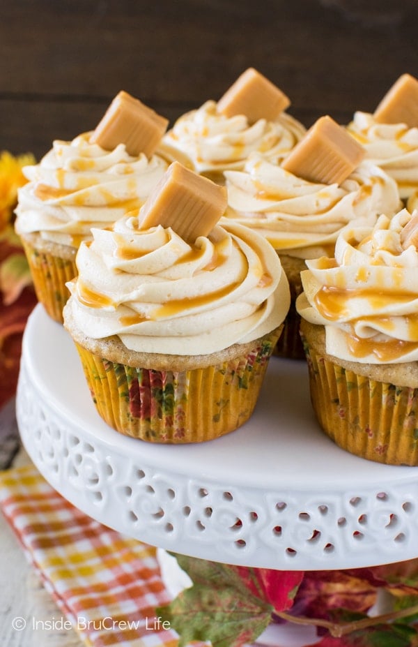 Caramel drizzles and candies add a sweet flavor to these Banana Caramel Cupcakes! Great dessert recipe.