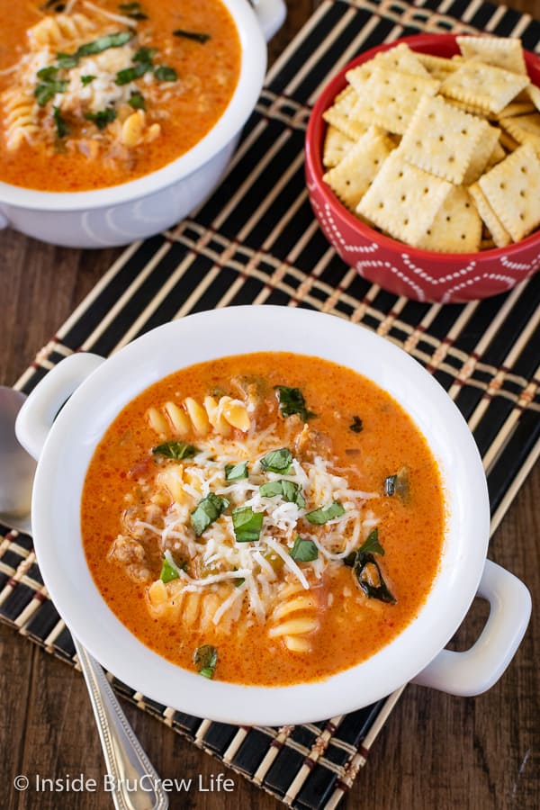Creamy Italian Tomato Soup - veggies, meat, cheese, and pasta give this tomato soup a delicious flavor. This easy recipe can be on your dinner table in under 30 minutes. #soup #tomato #homemade #creamytomato #dinner