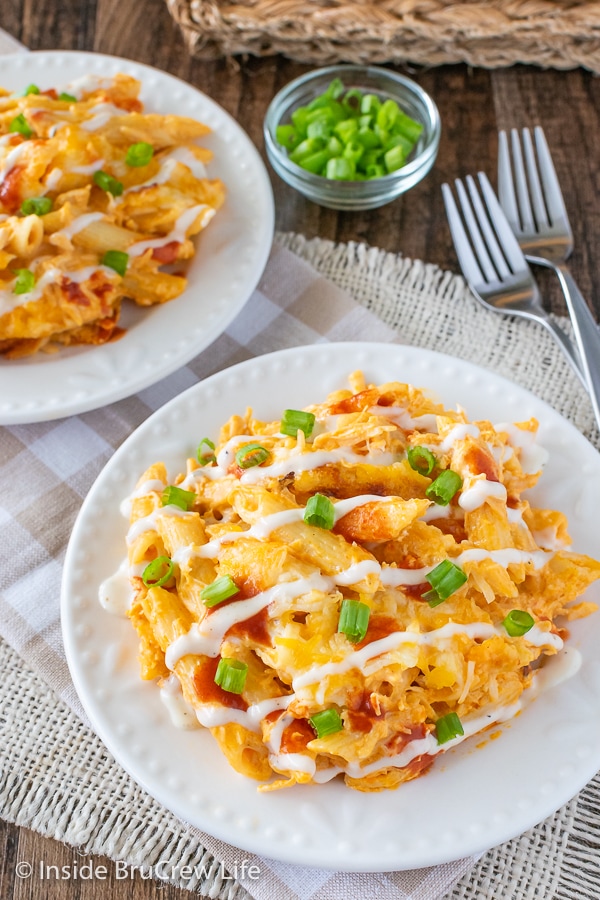 Overhead picture of a white plate with buffalo chicken pasta on it.