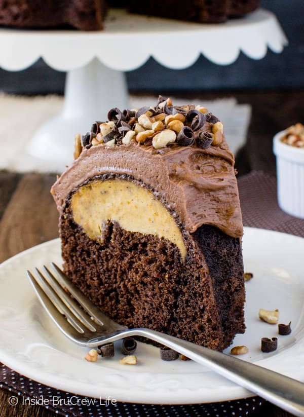 Chocolate Pumpkin Cheesecake Bundt Cake - a hidden pumpkin center and creamy chocolate frosting will make this cake a favorite treat at fall parties! Great dessert recipe!