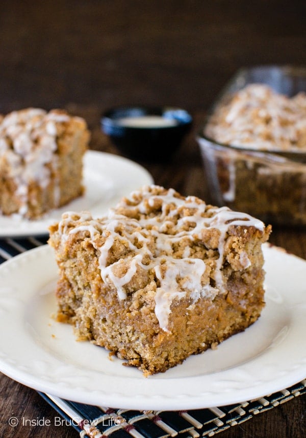 Banana Caramel Coffee Cake - a sweet caramel cheesecake is hidden under crumbs and glaze. This is an awesome breakfast or dessert recipe!