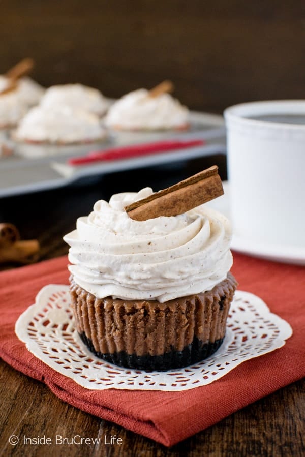 Chocolate Chai Cheesecakes - a cookie crust, creamy cheesecake, & spiced topping makes this mini cheesecake dessert a delicious fall recipe. 