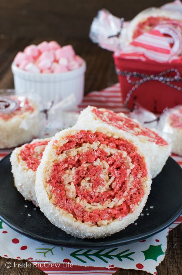 These easy no bake Peppermint Rice Krispies Pinwheels have swirls of color and a white chocolate sugar coating. Fun recipe for holiday parties!