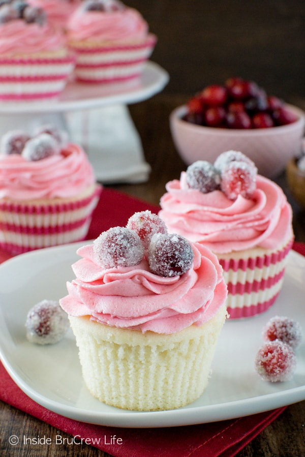 Sparkling Cranberry White Chocolate Cupcakes - these easy homemade cupcakes have a hidden filling and berry frosting. Great recipe for the holidays!