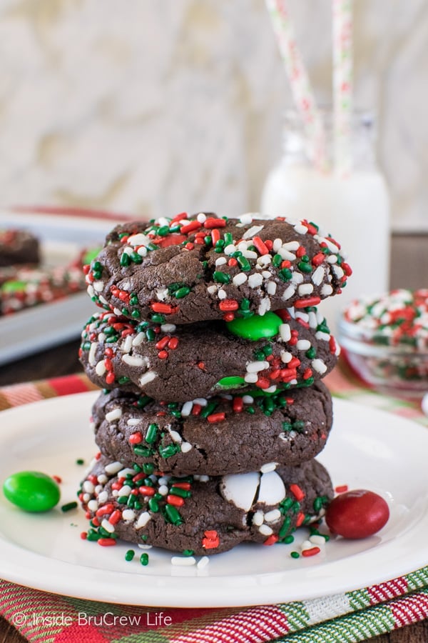 A stack of 4 Chocolate Mint Pudding Cookies on a white plate.