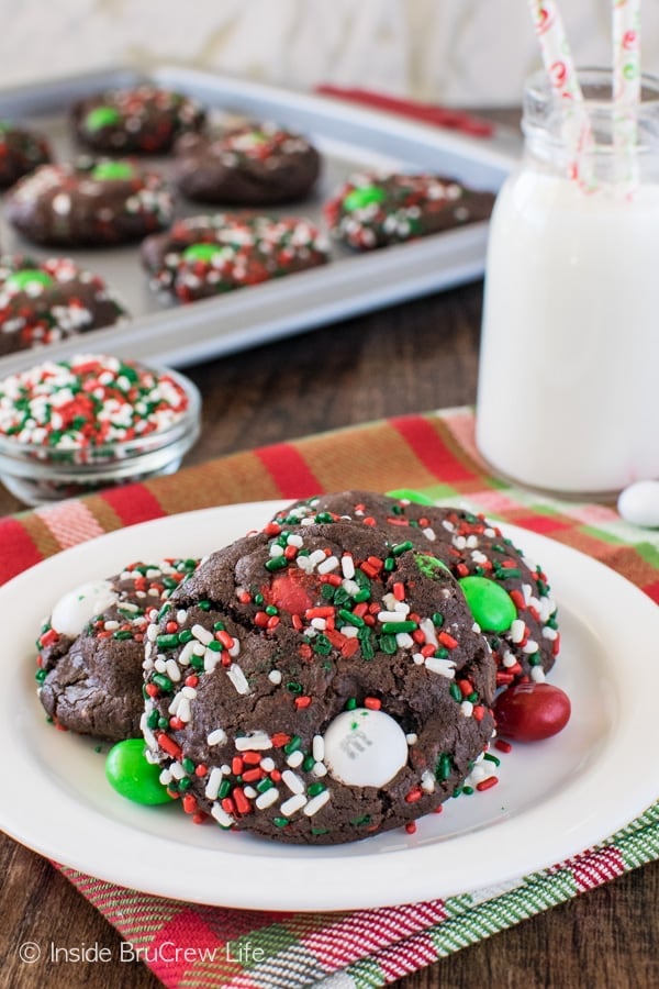 3 Chocolate Mint Pudding Cookies covered in Christmas sprinkles with red, green, and white M&M's.