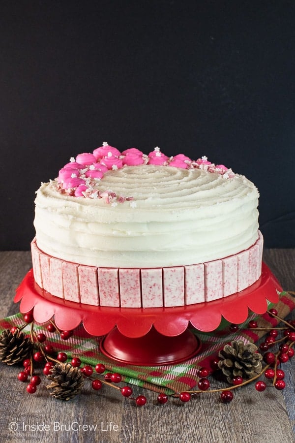Layers of peppermint frosting, candies, & sprinkles make this Chocolate Peppermint Layer Cake a great recipe for holiday parties!