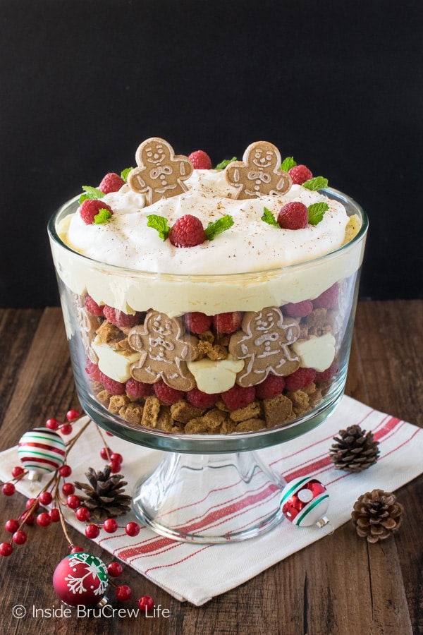 No Bake Eggnog Cheesecake Trifle - this easy cheesecake dessert has layers of cookies, berries, & cheesecake. Great recipe for holiday parties!