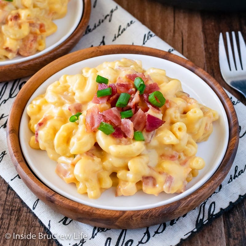 A white plate with creamy mac and cheese on it.