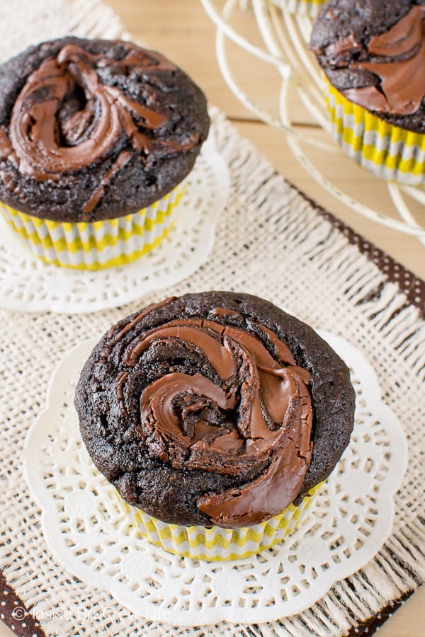 An overhead picture of the tops of two chocolate nutella banana muffins