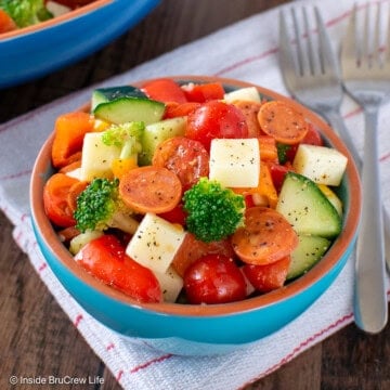 A small bowl filled with an Italian veggie salad.