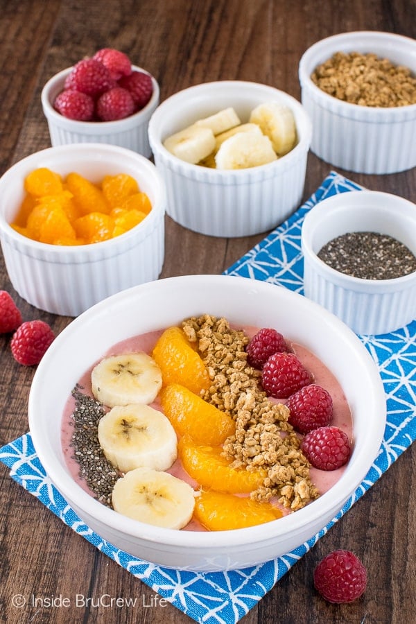 Raspberry Orange Frozen Yogurt Bowls - fresh fruit and granola makes this easy frozen fruit yogurt a sweet but healthy snack recipe.