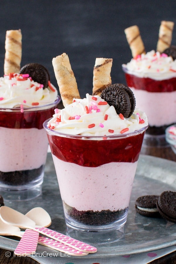 Strawberry Mousse Cheesecake Parfaits - layers of no bake strawberry cheesecake, cookies, and pie filling make these a fun and easy dessert. Great recipe for Valentine's day.