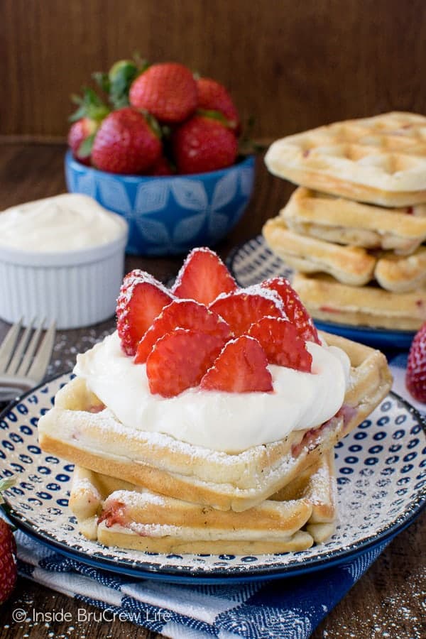 Homemade Strawberry Waffles - fill your freezer with a batch of these easy waffles. Lemon cream and berries make this a must make breakfast recipe!