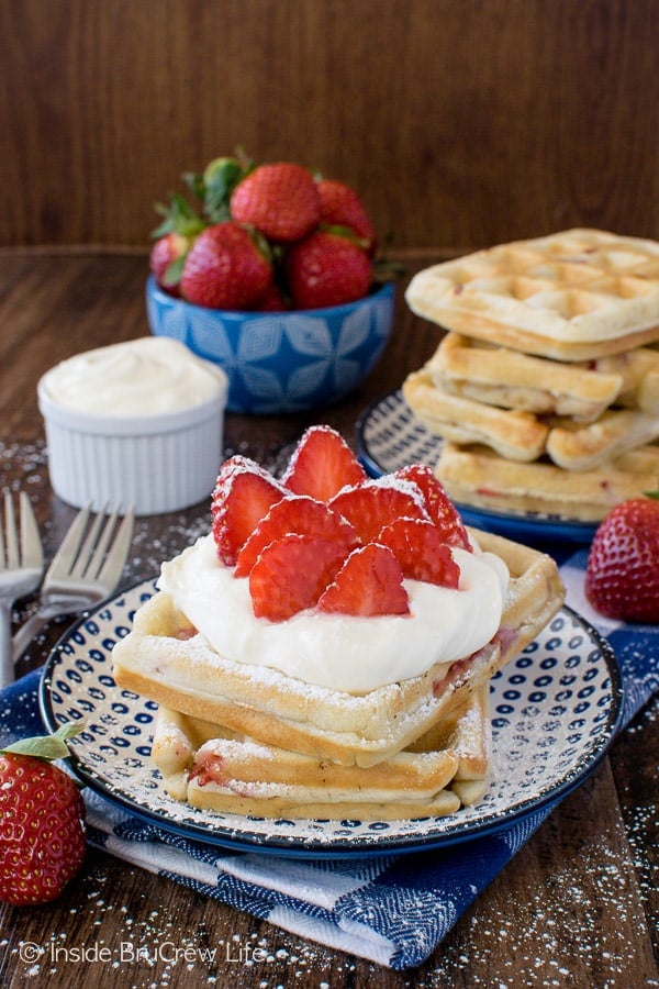 Homemade Strawberry Waffles - these easy breakfast waffles are the perfect thing to fill your freezer with. Fresh berries and lemon cream make these a delicious breakfast recipe!