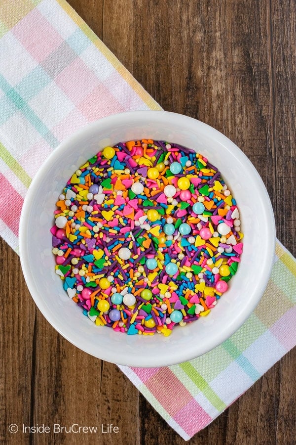 A bowl of brightly colored sprinkles.