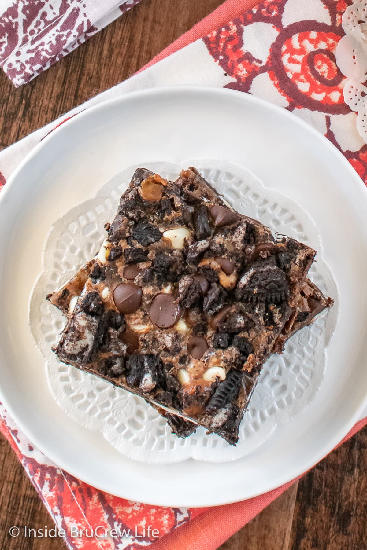 Overhead picture of chocolate cookie bars on a white plate.