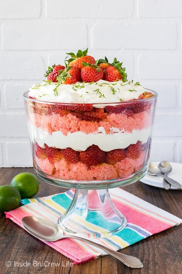 Strawberry Key Lime Cheesecake Trifle - creamy tart no bake cheesecake, cake, and sliced strawberries layered in a bowl makes an impressive dessert! Great easy recipe for spring or summer!