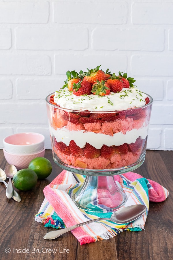 Strawberry Key Lime Cheesecake Trifle - layers of no bake cheesecake, fruit, and cake in one large bowl. Easy dessert recipe for spring or summer dinner parties!