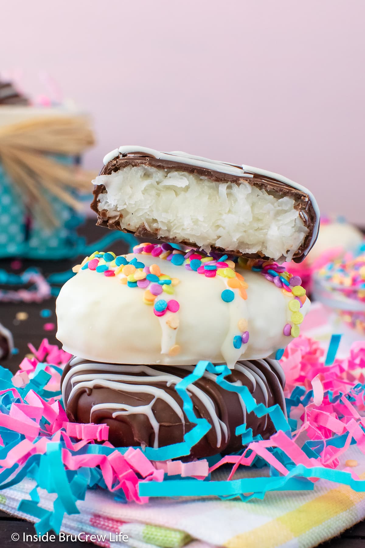 A stack of white and dark chocolate covered Easter eggs.