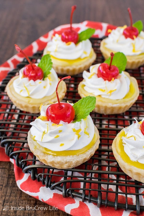 Mini Lemon Cheesecake Pies - swirls of cheesecake and lemon pie filling creates a cute and delicious mini pie. Great dessert recipe for spring or summer parties!