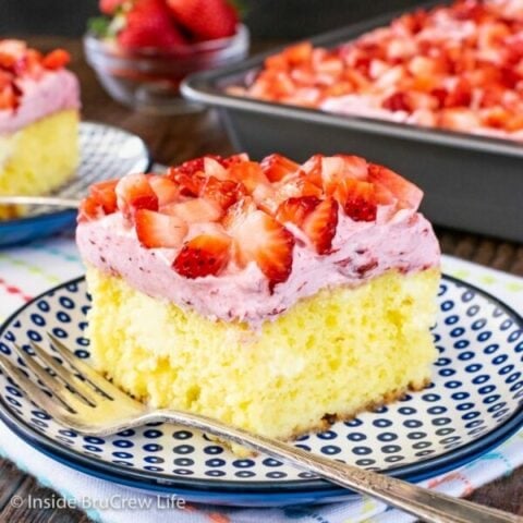 A blue and white plate with a piece of lemon strawberry cake on it.