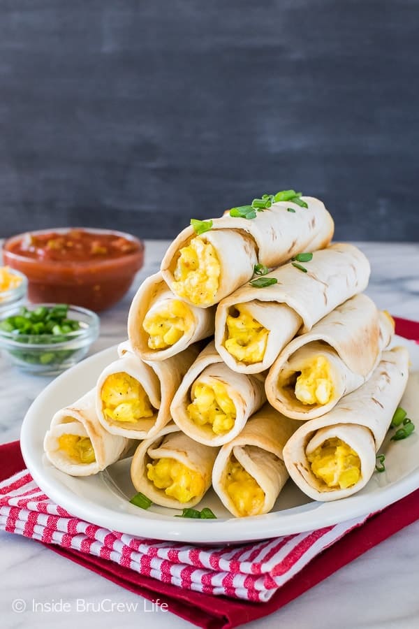 Green Chile Egg Taquitos - roll up eggs, cheese, and chiles in tortillas for an easy grab and go breakfast recipe that the whole family will love