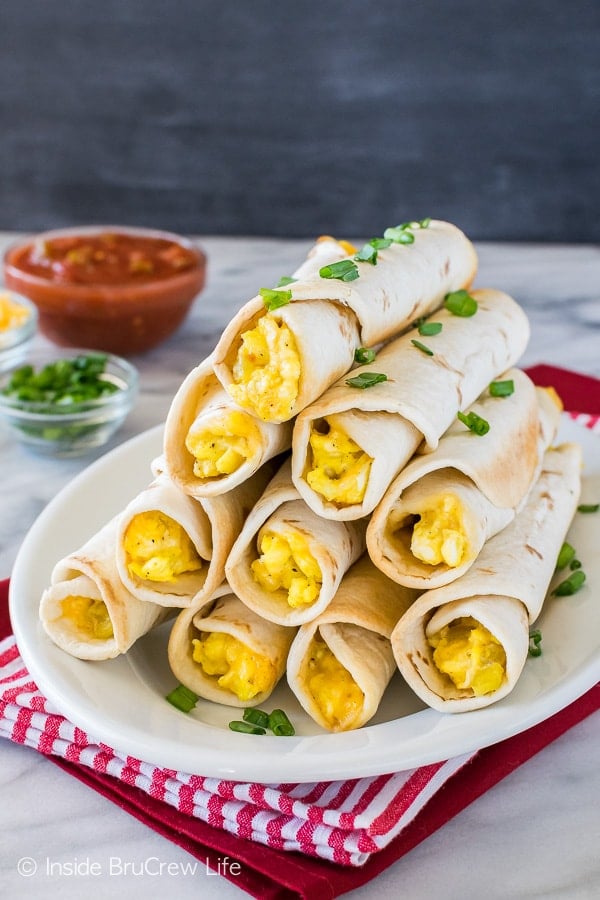 Green Chile Egg Taquitos - tortillas filled with eggs, cheese, and green chiles is a great breakfast. Make this recipe ahead to save time in the morning.