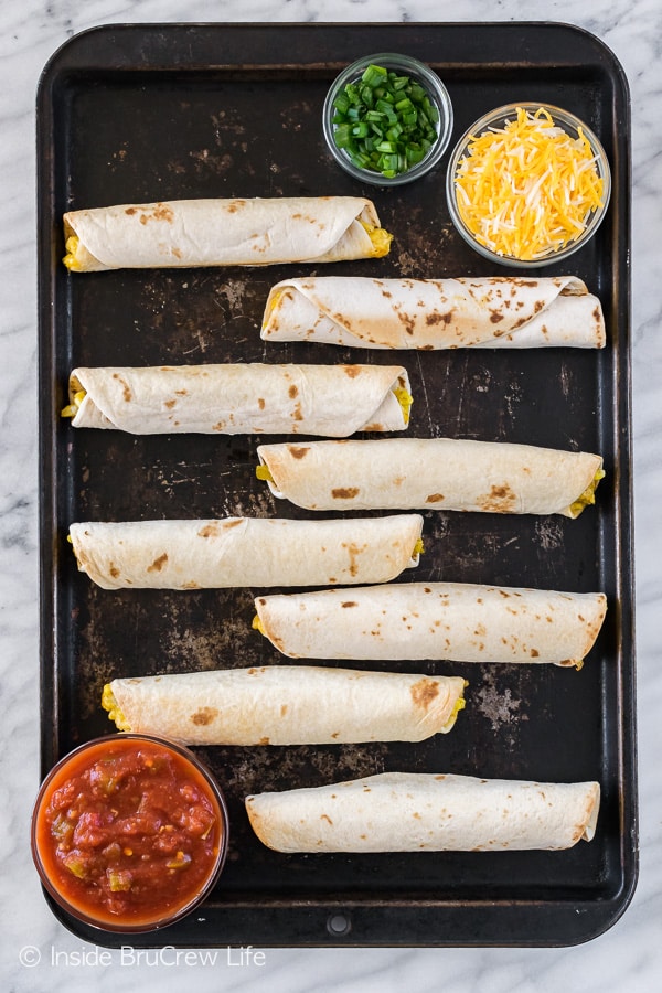 Green Chile Egg Taquitos - these easy breakfast tacos can be frozen ahead of time. Great recipe that the whole family will love for breakfast.