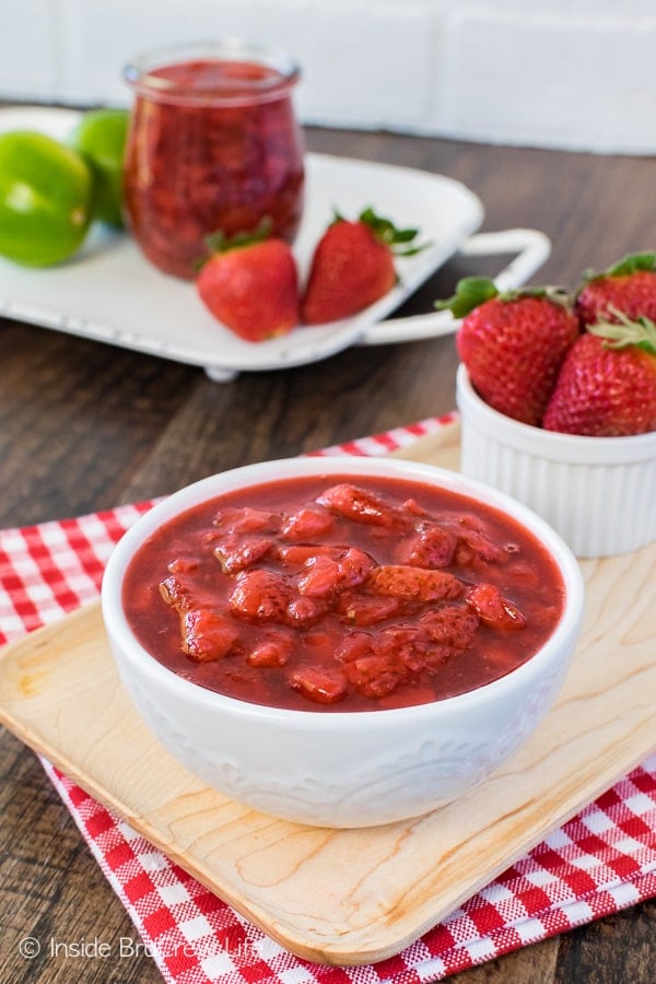 Honey Lime Strawberry Sauce - fresh berries, honey, and lime zest makes an easy fruit topping. Great recipe to eat on cakes, ice cream, or cheesecake!