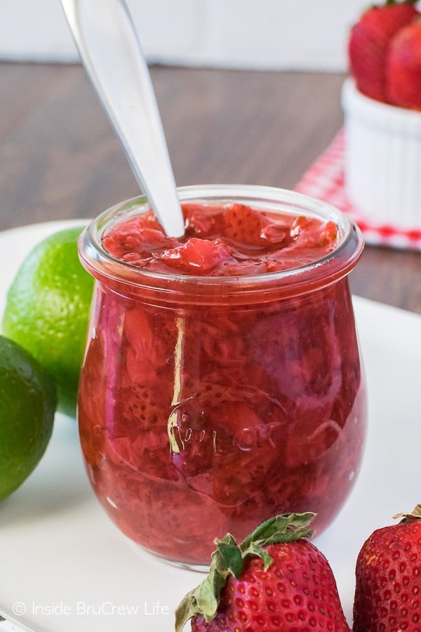 Honey Lime Strawberry Sauce - keep a jar of this easy fruit topping in your fridge. It's the perfect recipe to add to any cake, bowl of ice cream, or cheesecake!