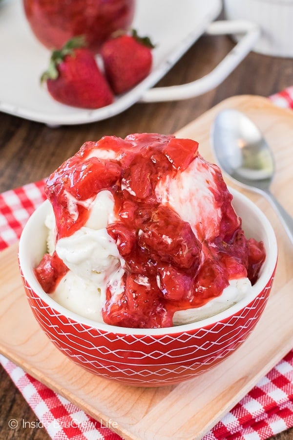 Honey Lime Strawberry Sauce - fresh strawberries, honey, & lime zest boiled down creates a silky smooth fruit topping. Great recipe for eating with ice cream, cheesecake, or by the spoonful!