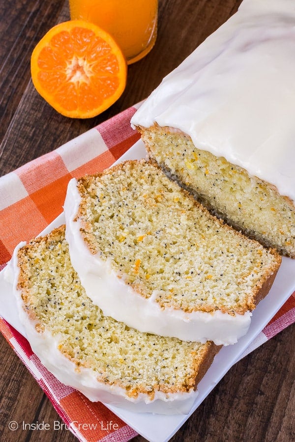 Frosted Orange Poppy Seed Bread - three times the orange love makes this sweet bread recipe the best! Frosting and poppy seeds add a fun flair to breakfast!