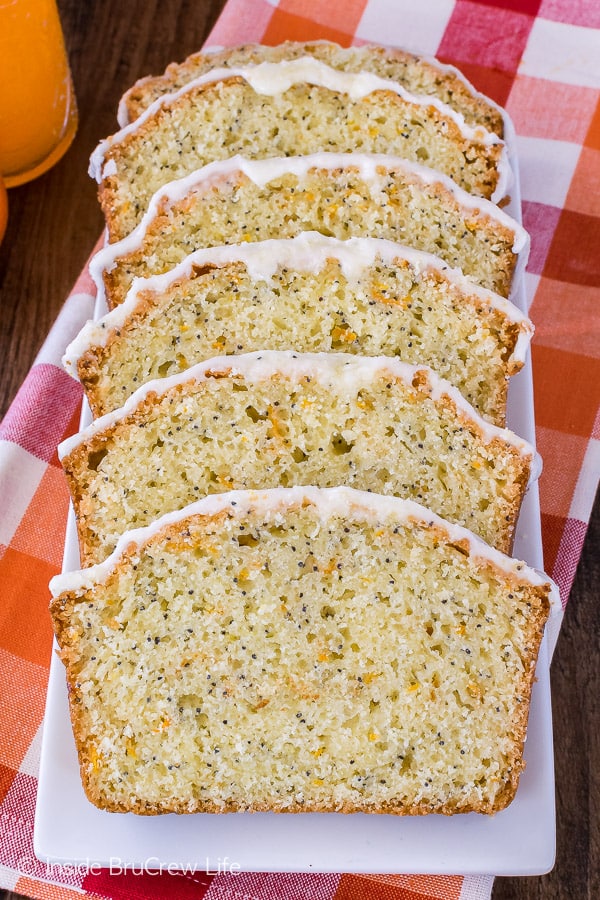 Frosted Orange Poppy Seed Bread - frosting and poppy seeds add a fun twist to this easy orange bread. Great recipe for breakfast!