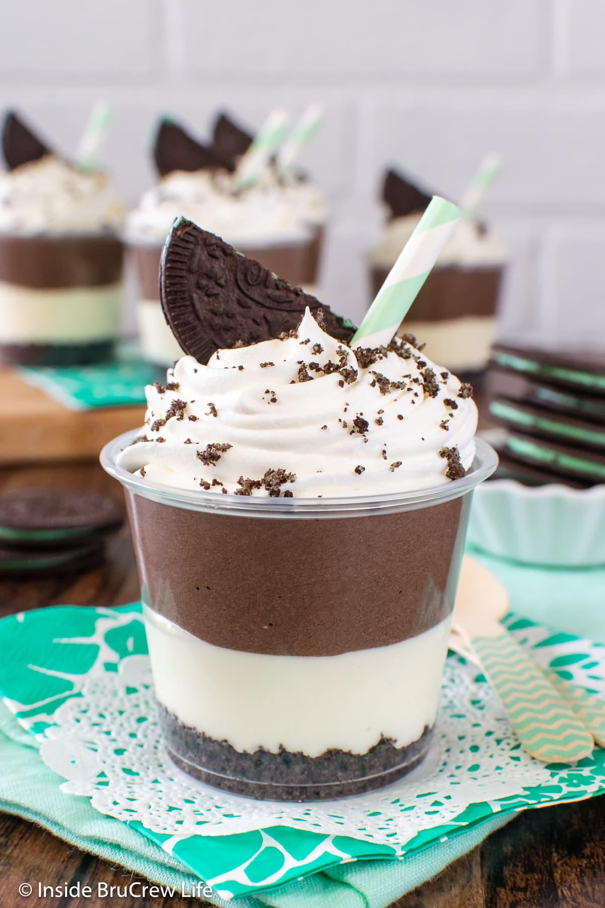 A small parfait cup filled with chocolate mint cheesecake filling.