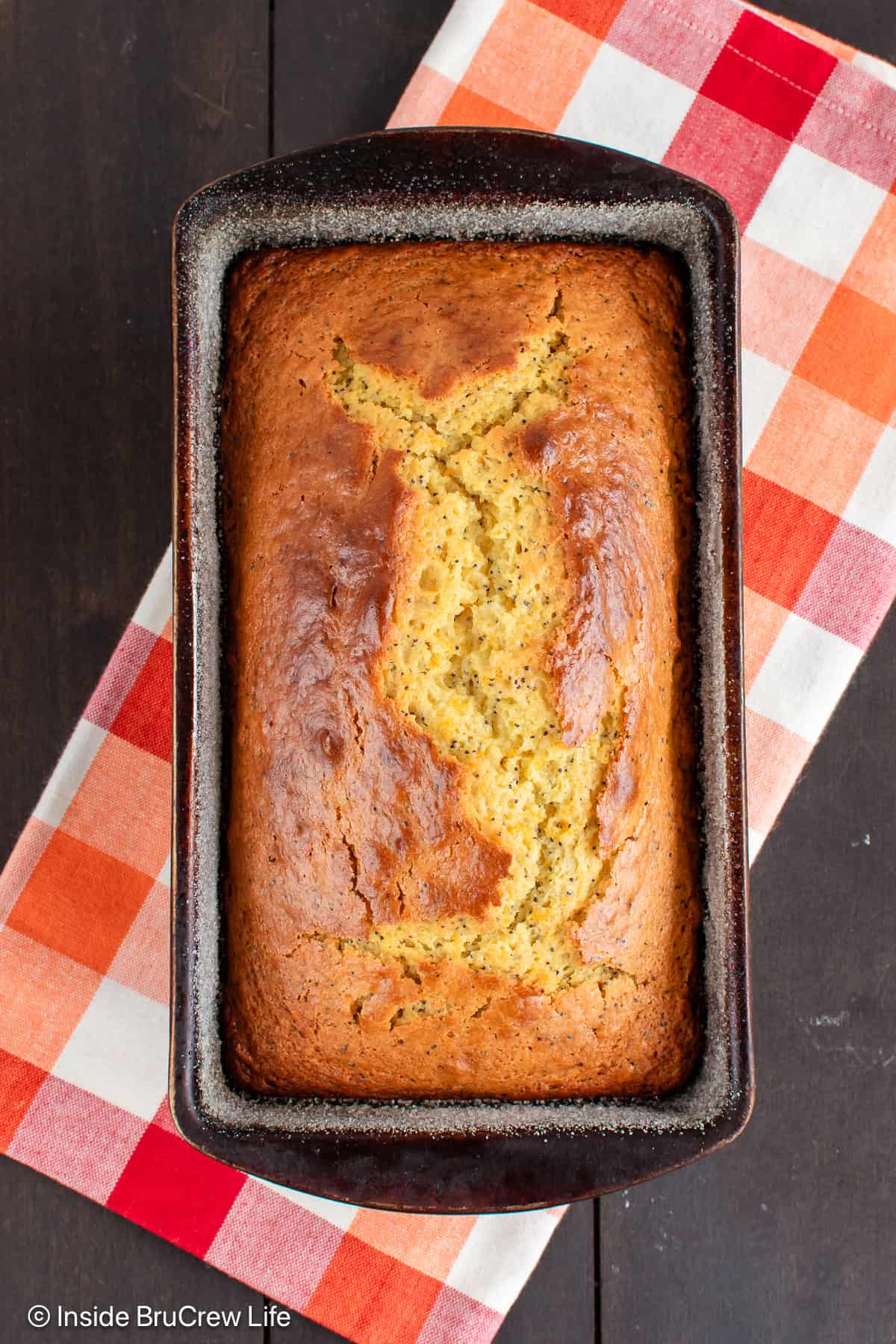 An overhead picture of a baked orange loaf.